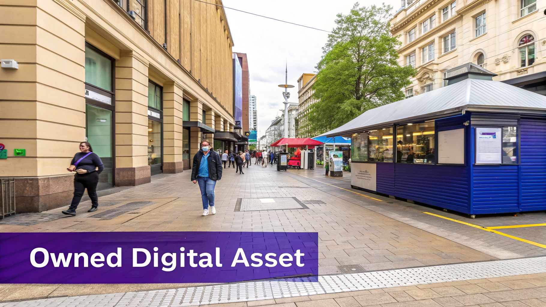 A busy city street with pedestrians, shops, and a blue kiosk under a cloudy sky.