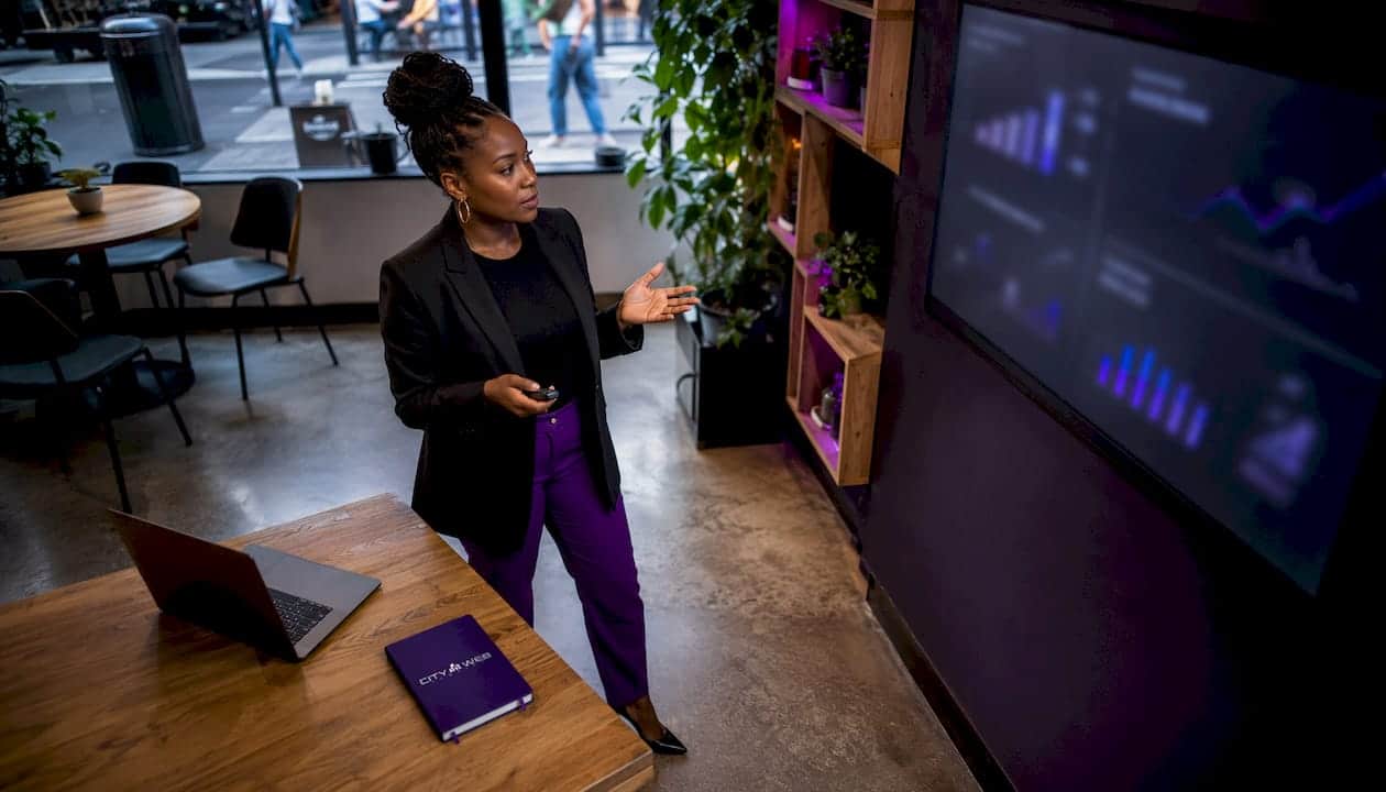 Businesswoman analyzing social media data screens