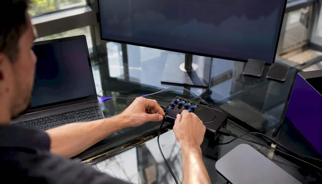 Hands testing website accessibility on digital devices