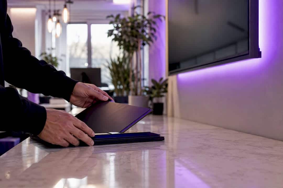 Hands managing branded asset templates