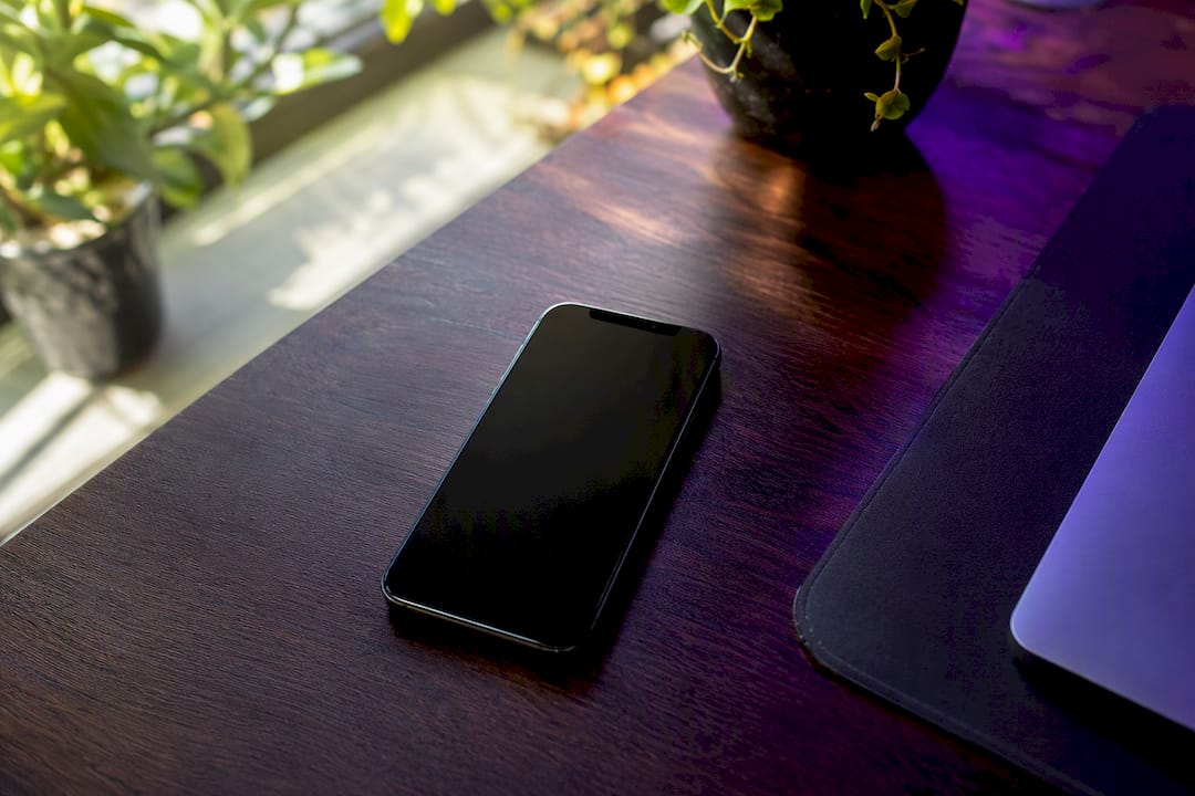 Smartphone on desk with tech lighting