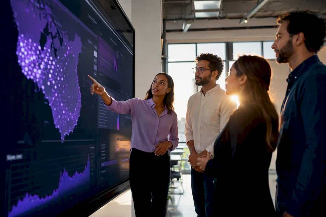 Team analyzing geo-targeting data in modern office