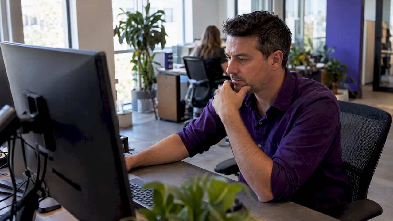 Strategist reviewing support tickets for FAQ topics